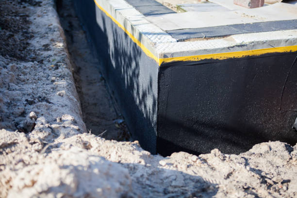 Professional Waterproofing technician working in Millington, MI